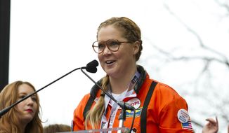 In this Jan. 21, 2017, file photo, comedian Amy Schumer speaks to the crowd during the Women&#39;s March rally in Washington. Variety reported on March 23, 2017, that Schumer dropped out of a live-action big screen version of Barbie due to scheduling conflicts. ( AP Photo/Jose Luis Magana, File)