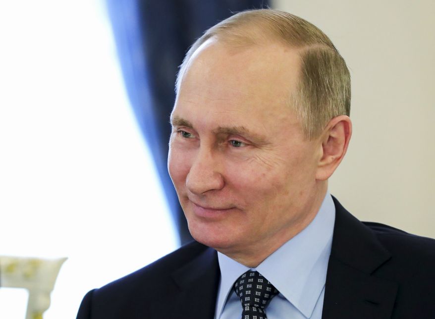 Russian President Vladimir Putin smiles during a meeting with French far-right presidential candidate Marine Le Pen, in the Kremlin in Moscow, Russia, Friday, March 24, 2017. (Mikhail Klimentyev, Sputnik, Kremlin Pool Photo via AP) ** FILE **