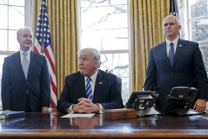 President Donald Trump, flanked by Health and Human Services Secretary Tom Price, left, and Vice President Mike Pence, right, before addressing members of the media regarding the health care overhaul bill, Friday, March 24, 2017, in the Oval Office of the White House in Washington. (AP Photo/Pablo Martinez Monsivais)