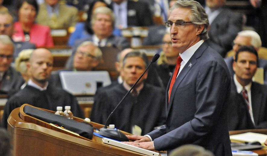 FILE - In this Jan. 3, 2017, file photo, Gov. Doug Burgum opens North Dakota&#x27;s 65th legislative assembly in Bismarck. Siding with the Second Amendment rights of North Dakota citizens&#x27; over others&#x27; concerns about safety, Burgum late Thursday, March 23, signed legislation that would allow most adults to carry a hidden firearm without a permit. (Tom Stromme/The Bismarck Tribune via AP, File)