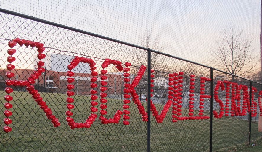 Plastic cups spell out Rockville Strong, at Rockville High School in Rockville, Maryland, on Thursday, March 23, 2017. The school has been thrust into the national immigration debate after a 14-year-old student said she was raped in a bathroom, allegedly by two classmates, including one who authorities said came to the U.S. illegally from Central America. (AP Photo/Brian Witte) ** FILE **