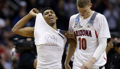 Arizona guard Allonzo Trier, let, and Lauri Markkanen (10) walks off the court after a loss to Xavier during an NCAA Tournament college basketball regional semifinal game Thursday, March 23, 2017, in San Jose, Calif. (AP Photo/Tony Avelar)