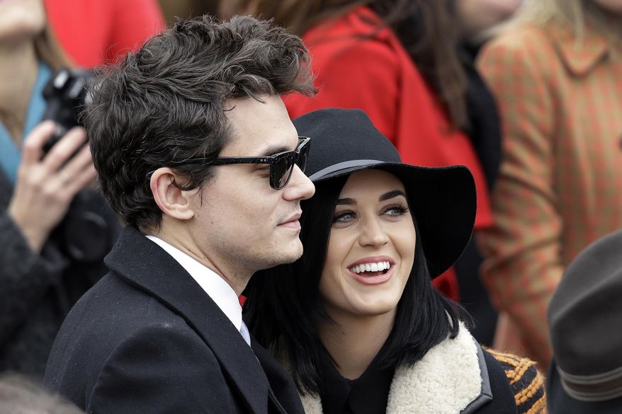 FILE - In this Jan. 21, 2013, file photo, John Mayer and Katy Perry arrive at the ceremonial swearing-in for President Barack Obama at the U.S. Capitol during the 57th Presidential Inauguration in Washington. Perry told The New York Times for an article published online March 23, 2017, that his new single, “Still Feel Like Your Man,” is about Perry. (AP Photo/J. Scott Applewhite, File)