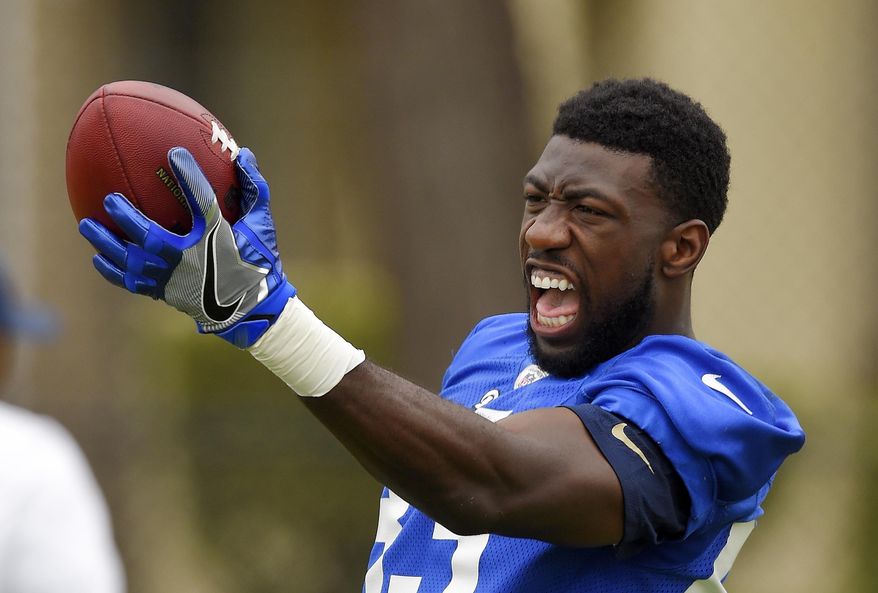 FILE - In this June 14, 2016, file photo, then-Los Angeles Rams wide receiver Brian Quick catches a pass as part of a drill during NFL football practice in Oxnard, Calif. The Washington Redskins have agreed to terms with former Los Angeles Rams wide receiver Brian Quick. The signing adds depth to the Redskins’ receiving corps after they lost DeSean Jackson and Pierre Garcon in free agency. Quick’s agency, SportsTrust Advisors, announced the move on their Twitter account Friday, March 24, 2017. (AP Photo/Mark J. Terrill, File)