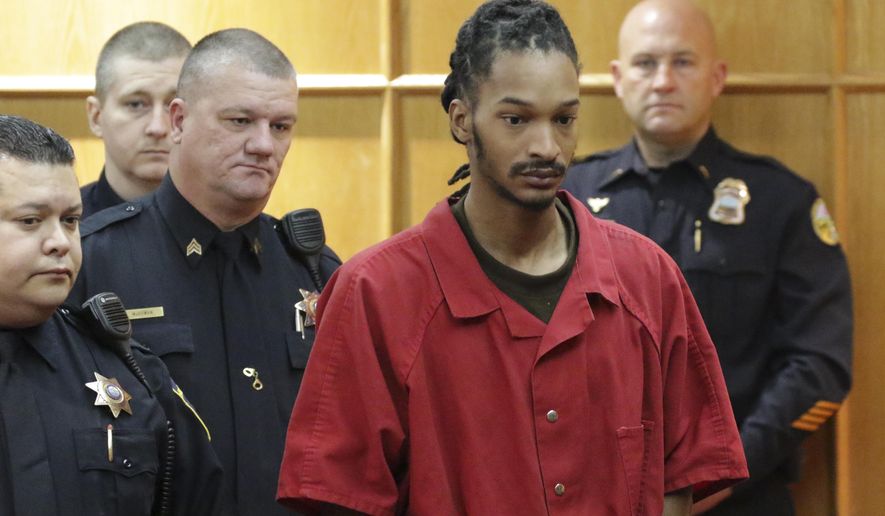 FILE- In this Nov. 21, 2017 file photo, Johnthony Walker, the driver involved in a school bus crash that sent 31 of the 37 students on board to the hospital resulting in six fatalities, appears in Hamilton County court, Tenn. Walker pleaded not guilty to six counts of vehicular manslaughter during a court hearing Friday, March 24. (Dan Henry /Chattanooga Times Free Press via AP, File)
