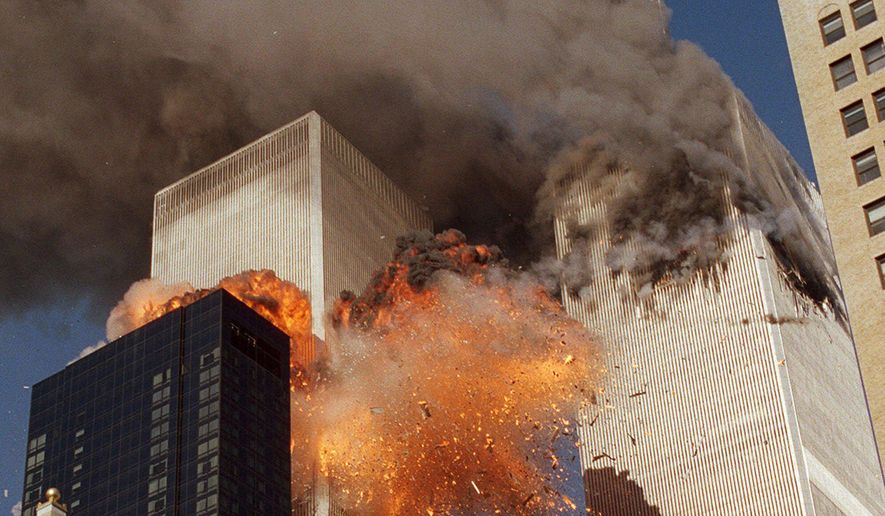 In this Sept. 11, 2001, file photo, smoke billows from one of the towers of the World Trade Center and flames as debris explodes from the second tower in New York. Family members of 9/11 families and others harmed in the terrorist attacks are on a fresh quest to hold Saudi Arabia responsible. A magistrate judge presiding over a Thursday, March 23, 2017, hearing says she hopes to streamline the legal process to speed the lawsuits along. (AP Photo/Chao Soi Cheong, File)