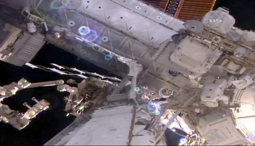 This still image taken from live video provided by NASA shows astronaut Shane Kimbrough, right, works on the International Space Station during a space walk on Friday, March 24, 2017.    Kimbrough and France&#39;s Thomas Pesquet emerged early from the orbiting complex, then went their separate ways to accomplish as much as possible 250 miles up. Their main job involves disconnecting an old docking port. This port needs to be moved in order to make room for a docking device compatible with future commercial crew capsules. (NASA via AP)