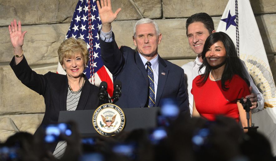 From left, SBA Administrator Linda McMahon, Vice President Mike Pence , Ronald Regan Foster, and Nancy Reagan Foster stand before a crowd on Saturday, March 25, 2017 in Charleston, W.Va.   Pence traveled to Charleston to talk about jobs and small businesses in the wake of a stinging defeat for the Trump administration on health care.  (Justin Rogers/Charleston Gazette-Mail via AP)