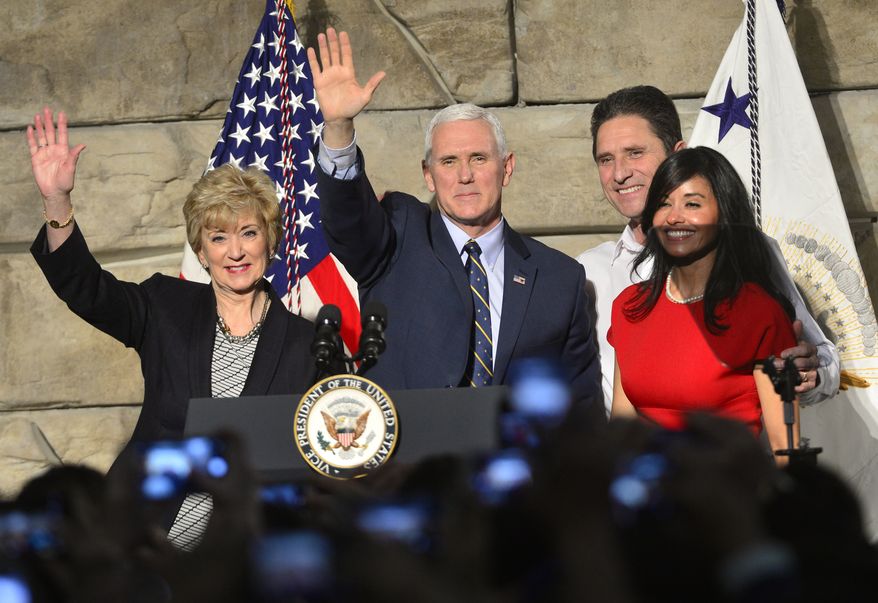 From left, SBA Administrator Linda McMahon, Vice President Mike Pence , Ronald Regan Foster, and Nancy Reagan Foster stand before a crowd on Saturday, March 25, 2017 in Charleston, W.Va.   Pence traveled to Charleston to talk about jobs and small businesses in the wake of a stinging defeat for the Trump administration on health care.  (Justin Rogers/Charleston Gazette-Mail via AP)