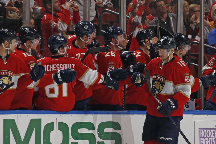 Florida Panthers center Aleksander Barkov (16) is congratulated by teammates after scoring a goal during the second period of an NHL hockey game against the Chicago Blackhawks, Saturday, March 25, 2017, in Sunrise, Fla. (AP Photo/Joel Auerbach)