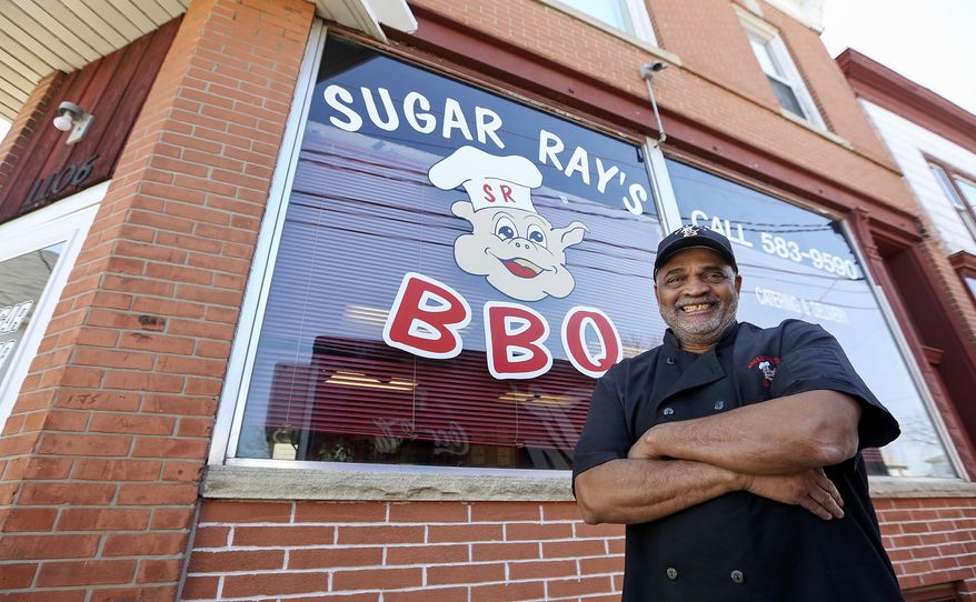 ADVANCE FOR THE WEEKEND OF MARCH 25-26 AND THEREAFTER - In this Friday, Mar. 17, 2017 photo, Ray Sanders poses in front of his business, Sugar Ray's BBQ, in Dubuque, Iowa. Sugar Ray's BBQ has stopped accepting dine-in and carry-out customers and will close completely this fall. (Nicki Kohl/Telegraph Herald via AP)