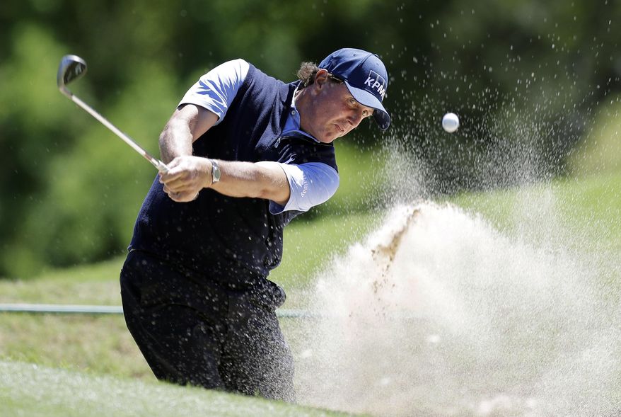 Phil Mickelson plays a shot from a bunker on the fifth hole during quarterfinal play at the Dell Technologies Match Play golf tournament at Austin County Club, Saturday, March 25, 2017, in Austin, Texas. (AP Photo/Eric Gay)