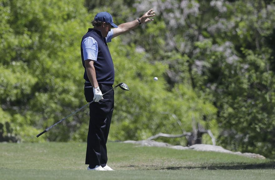 Phil Mickelson takes a drop after he hit into a hazard during quarterfinal play at the Dell Technologies Match Play golf tournament at Austin County Club, Saturday, March 25, 2017, in Austin, Texas. (AP Photo/Eric Gay)