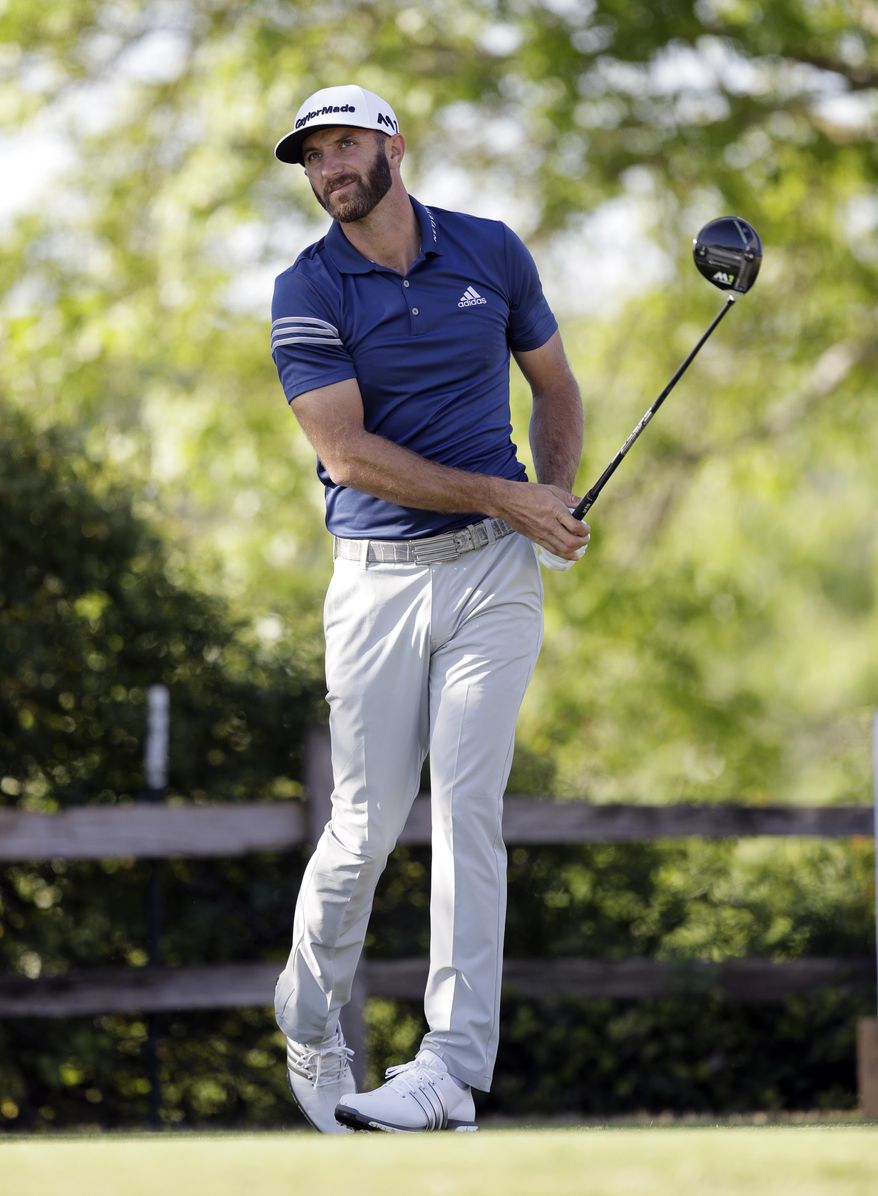 Dustin Johnson watches his tee shot on the sixth hole during the round of 16 play at the Dell Technologies Match Play golf tournament at Austin County Club, Saturday, March 25, 2017, in Austin, Texas. (AP Photo/Eric Gay)