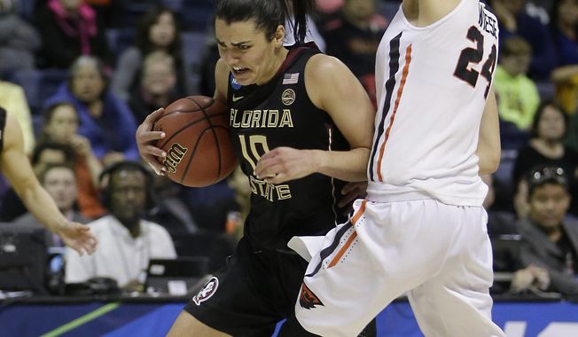 Florida State guard Leticia Romero, left, drives against Oregon State guard Sydney Wiese during the first half of a regional semi-final round game of an NCAA college basketball tournament, Saturday, March 25, 2017, in Stockton, Calif. (AP Photo/Rich Pedroncelli)