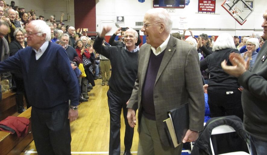 U.S. Senators Bernie Sanders, left, Patrick Leahy, right, and Rep. Peter Welch center, hold a town hall meeting with constituents Saturday, March 25, 2017, in Hardwick, Vt. The three-member congressional delegation called the defeat of the Republican health care plan a victory. (AP Photo/Lisa Rathke)