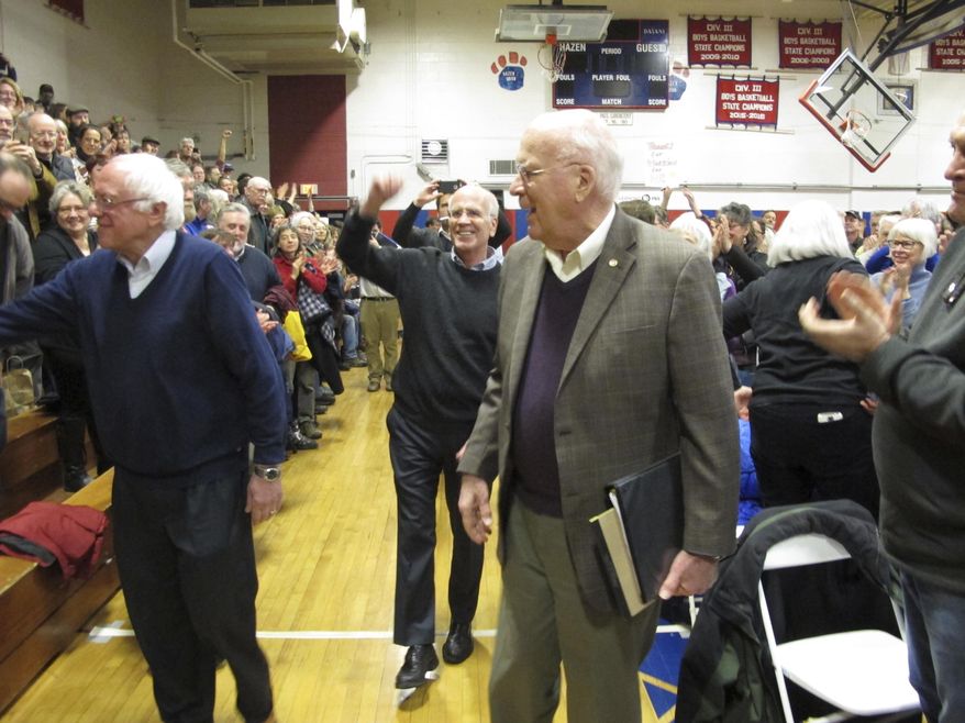 U.S. Senators Bernie Sanders, left, Patrick Leahy, right, and Rep. Peter Welch center, hold a town hall meeting with constituents Saturday, March 25, 2017, in Hardwick, Vt. The three-member congressional delegation called the defeat of the Republican health care plan a victory. (AP Photo/Lisa Rathke)