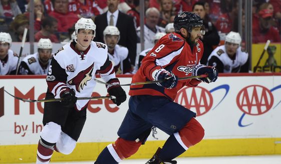 Washington Capitals left wing Alex Ovechkin (8) takes off down ice watched by Arizona Coyotes defenseman Connor Murphy (5) during an NHL hockey game Saturday, March 25, 2017, in Washington. (AP Photo/Molly Riley)