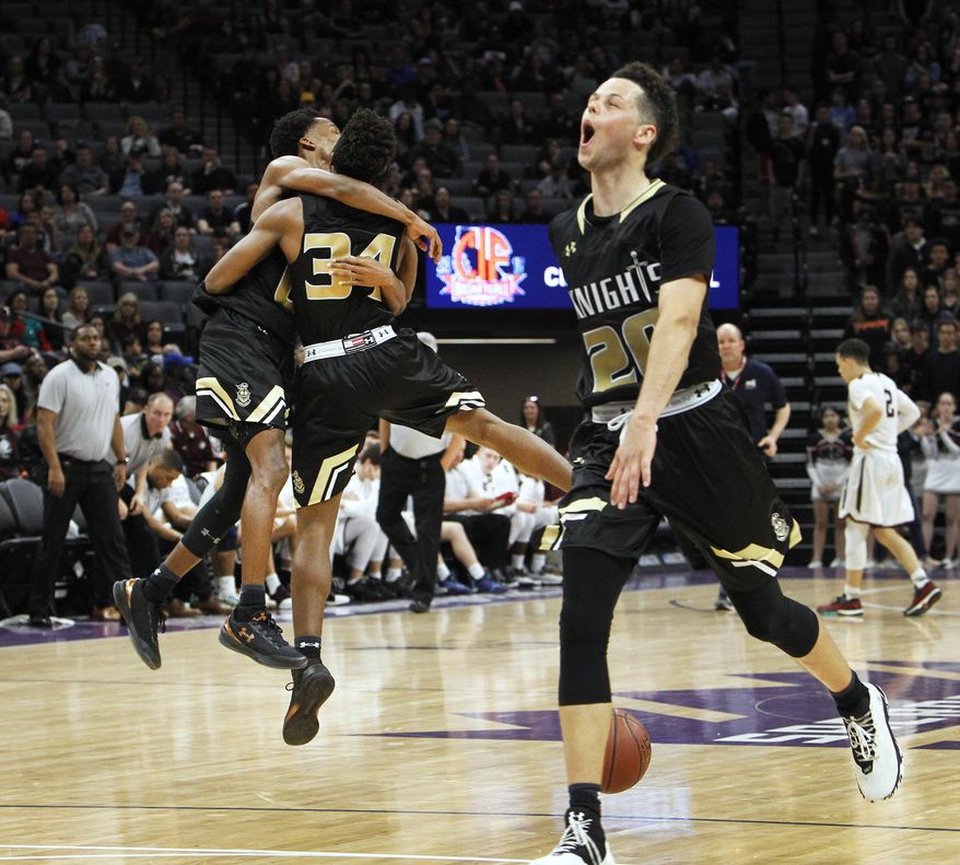 Bishop Montgomery forward Jordan Schakel (20) celebrates with teammates after beating Woodcreek in the boys' CIF Open Division high school basketball championship game in Sacramento, Calif., Saturday, March 25, 2017. Bishop Montgomery won 74-67. (AP Photo/Steve Yeater)