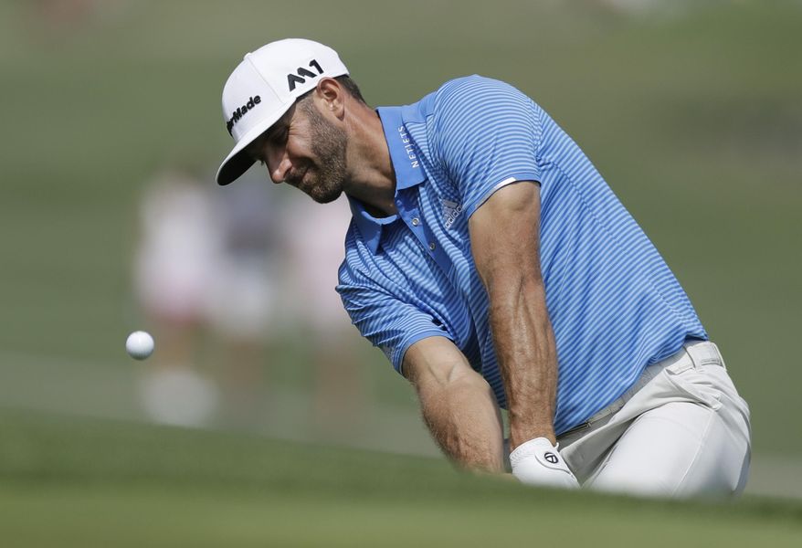 Dustin Johnson hits to the 16th green during semifinal play at the Dell Technologies Match Play golf tournament at Austin County Club, Sunday, March 26, 2017, in Austin, Texas. (AP Photo/Eric Gay)