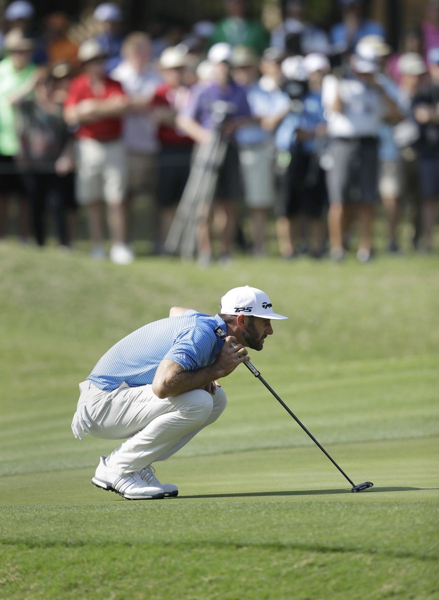 Dustin Johnson lines up his putt on the seventh hole during semifinal play at the Dell Technologies Match Play golf tournament at Austin County Club, Sunday, March 26, 2017, in Austin, Texas. (AP Photo/Eric Gay)
