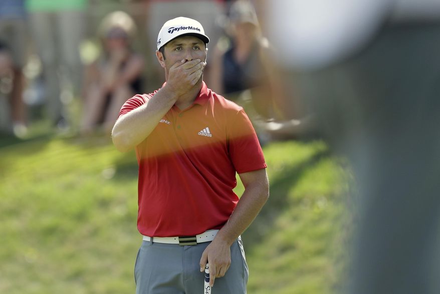 Jon Rahm, of Spain, reacts after his putt rolled off the green on the seventh hole during the final round of play against Dustin Johnson at the Dell Technologies Match Play golf tournament at Austin County Club, Sunday, March 26, 2017, in Austin, Texas. (AP Photo/Eric Gay)