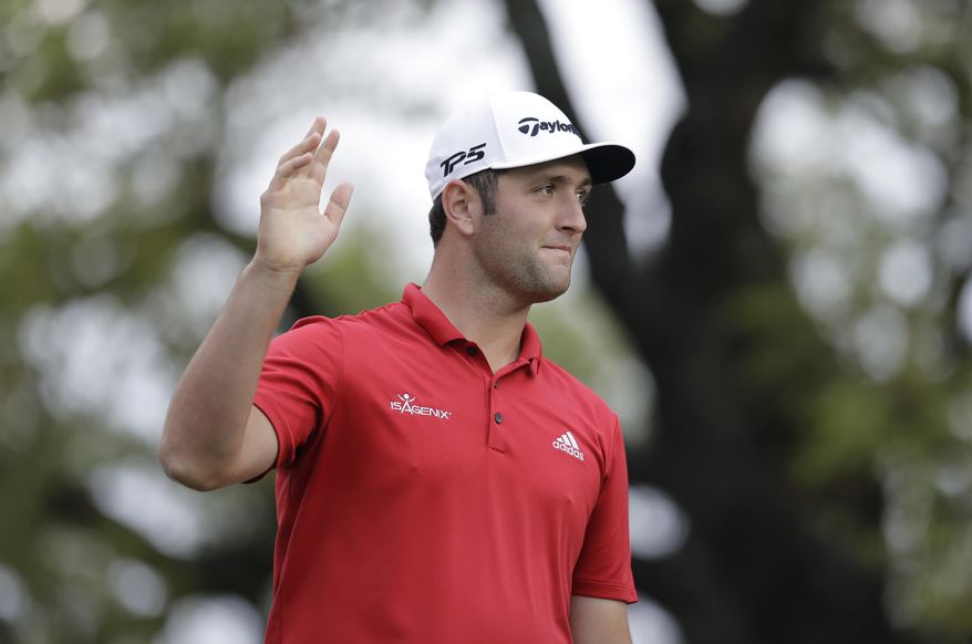 Jon Rahm of Spain waves to the gallery during semifinal play at the Dell Technologies Match Play golf tournament at Austin County Club, Sunday, March 26, 2017, in Austin, Texas. (AP Photo/Eric Gay)