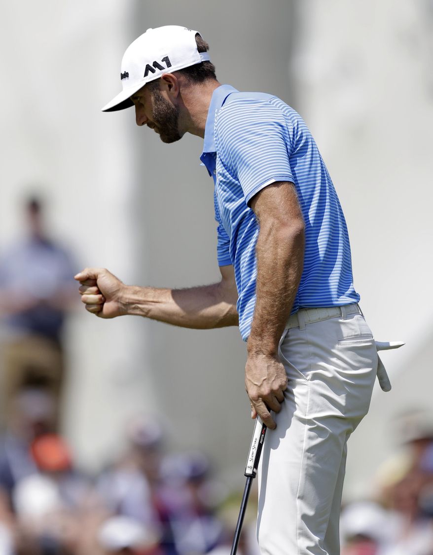 Dustin Johnson celebrates after making a putt on the 18th hole to win his match over Hideto Tanihara, of Japan, during semifinal play at the Dell Technologies Match Play golf tournament at Austin County Club, Sunday, March 26, 2017, in Austin, Texas. (AP Photo/Eric Gay)