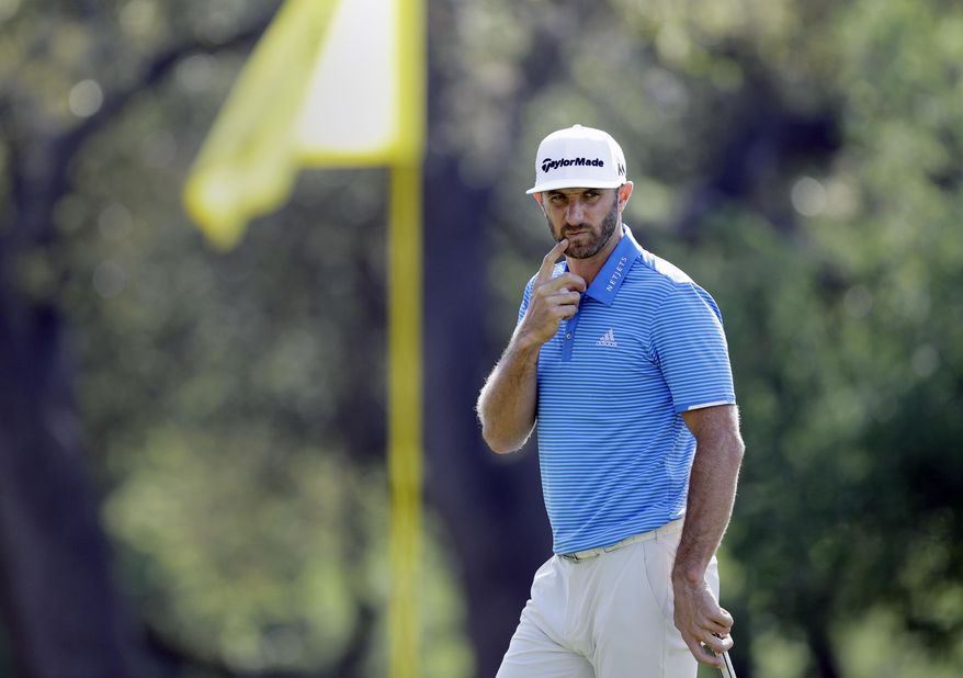 Dustin Johnson looks at his line on the sixth green during semifinal play at the Dell Technologies Match Play golf tournament at Austin County Club, Sunday, March 26, 2017, in Austin, Texas. (AP Photo/Eric Gay)
