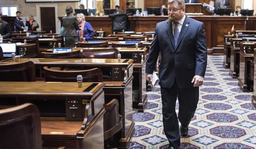 In this Jan. 10, 2017 file photo, Rep. Eric Bedingfield, R-Greenville, walks through the House chamber during the first day of legislative session at the South Carolina Statehouse in Columbia, S.C. Bedingfield once shunned marijuana use, but when his eldest son died of an overdose last Easter, ending a six-year struggle with opioid addiction, the conservative Republican co-sponsored this year's medical cannabis legislation. (AP Photo/Sean Rayford, File)