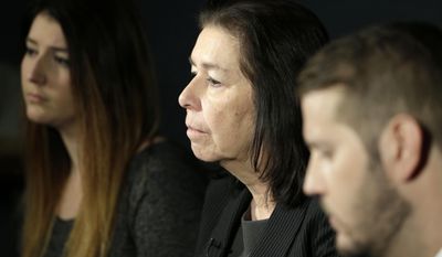 FILE - In this Jan. 18, 2016, file photo, Christine Levinson, center, wife of Robert Levinson, and her children, Dan and Samantha Levinson, talk to reporters in New York. The family of Robert Levinson, who went missing in Iran a decade ago on an unauthorized CIA assignment, filed a lawsuit Tuesday, March 21, 2017, against Iran. The lawsuit in U.S. federal court describes in detail offers by Iran to “arrange” for his release in exchange for a series of concessions, including for the return of a Revolutionary Guard general who defected to the West. (AP Photo/Seth Wenig, File)