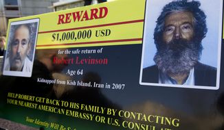 FILE -- In this March 6, 2012 file photo, an FBI poster showing a composite image of former FBI agent Robert Levinson, right, of how he would look like now after five years in captivity, and an image, left, taken from the video, released by his kidnappers, in Washington during a news conference. The family of Levinson, who went missing in Iran a decade ago on an unauthorized CIA assignment, filed a lawsuit Tuesday, March 21, 2017, against Iran. The lawsuit in U.S. federal court describes in detail offers by Iran to “arrange” for his release in exchange for a series of concessions, including for the return of a Revolutionary Guard general who defected to the West. (AP Photo/Manuel Balce Ceneta, File)