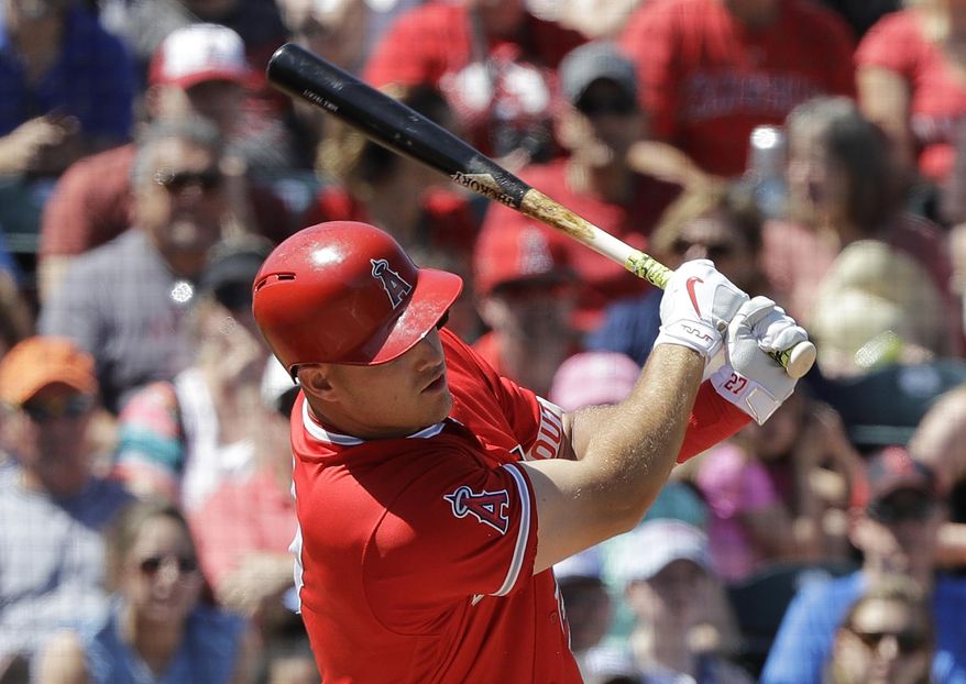 Los Angeles Angels&#x27; Mike Trout hits a double during the first inning of a spring training baseball game against the Kansas City Royals, Sunday, March 26, 2017, in Tempe, Ariz. (AP Photo/Darron Cummings)