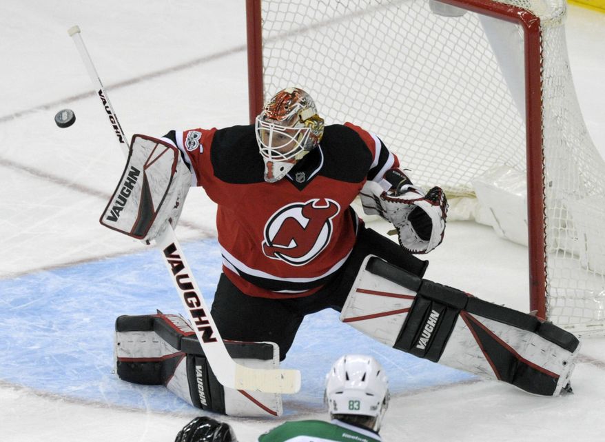 New Jersey Devils goalie Keith Kinkaid deflects the puck during the second period of an NHL hockey game against the Dallas Stars, Sunday, March 26, 2017, in Newark, N.J. (AP Photo/Bill Kostroun)
