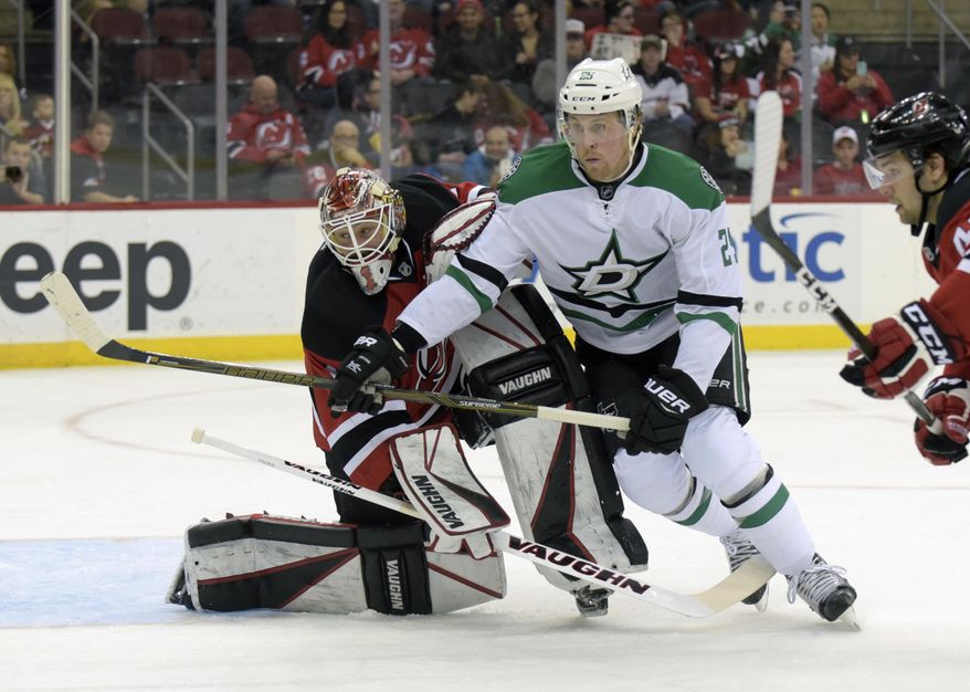 Dallas Stars right wing Brett Ritchie, right, runs into New Jersey Devils goalie Keith Kinkaid (1) during the first period of an NHL hockey game Sunday, March 26, 2017, in Newark, N.J. (AP Photo/Bill Kostroun)