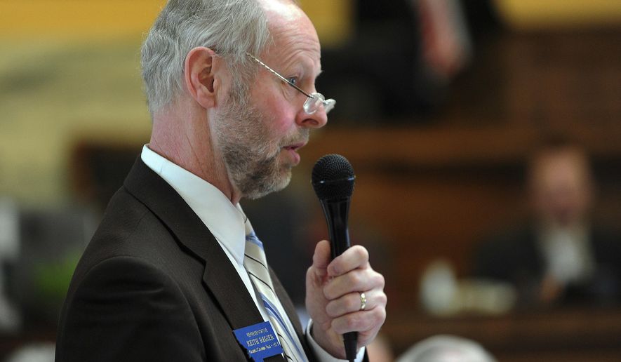FILE - In this March 21, 2013 file photo, Montana state Rep. Keith Regier, R-Kalispell speaks on the house floor in Helena, Montana. Regier, now a state senator, has proposed a bill poised to clear the state legislature in March 2017, which would forbid the use of religious and foreign laws in state courts that don't grant the same rights and privileges as the state or U.S. constitutions. While the legislation does not specifically mention Sharia law, both supporters and opponents refer to them as "Sharia law bills." Sharia law is what governs Islamic societies. (Eliza Wiley/The Independent Record via AP)