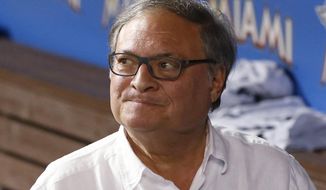 FILE - In this May 31, 2016, file photo, Miami Marlins owner and CEO Jeffrey Loria walks through the dugout after a baseball game between the Marlins and the Pittsburgh Pirates, in Miami. The Miami Marlins begin their 25th season without their late ace, his legacy badly tarnished by recently disclosed details of his death, which somehow makes the shadow over the franchise even darker. And then there’s the for-sale sign erected by unpopular owner Jeffrey Loria, tired of being scorned while his team gets ignored. (AP Photo/Wilfredo Lee, File)
