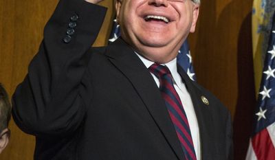 FILE - In this Jan. 3, 2017 file photo, U.S. Rep. Tim Walz, D-Minn., waves during his mock swearing-in ceremony on Capitol Hill in Washington. Walz said Monday, March 27, 2017, that he is running for governor of his home state of Minnesota in 2018 rather than trying to keep his seat in Congress. He joins a field of several Democrats seeing to replace fellow Democrat Gov. Mark Dayton, who&#39;s retiring. (AP Photo/Zach Gibson, File)