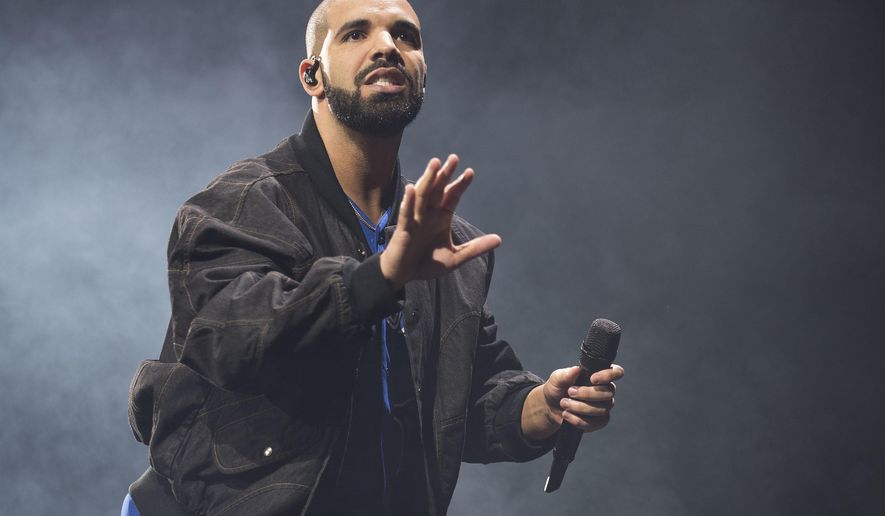 FILE - In this Oct. 8, 2016 file photo, Drake performs onstage in Toronto. Drake's new album “More Life” has broken the U.S. record for the number of streams from a single album in one week. The rapper’s 22-track album recorded 385 million streams across all platforms. (Photo by Arthur Mola/Invision/AP, File)