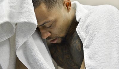 Kentucky guard Isaiah Briscoe sits in the locker room after Kentucky lost 75-73 to North Carolina in the South Regional final game in the NCAA college basketball tournament Sunday, March 26, 2017, in Memphis, Tenn. (AP Photo/Brandon Dill)