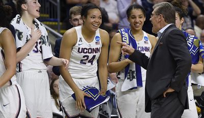 Connecticut head coach Geno Auriemma, right, jokes with Katie Lou Samuelson, left, Napheesa Collier, second from left, and Gabby Williams as the clock winds down on their 90-52 win over Oregon in a regional final game in the NCAA women&#x27;s college basketball tournament, Monday, March 27, 2017, in Bridgeport, Conn. (AP Photo/Jessica Hill)