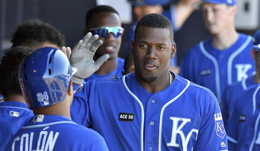Kansas City Royals&#39; Jorge Soler is congratulated after his two-run home run in the ninth inning of a spring training baseball game against the Seattle Mariners in Peoria, Ariz., Friday, March 24, 2017. (John Sleezer/The Kansas City Star via AP)