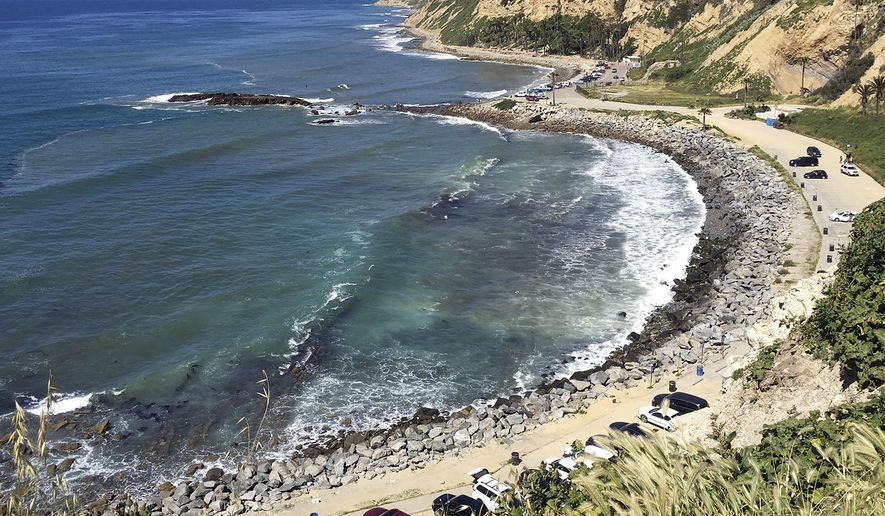 In this Sunday, March 26, 2017, photo, Royal Palms Beach in the San Pedro area of Los Angeles is protected by boulders placed there to forestall erosion. A new study predicts that with limited human intervention, 31 percent to 67 percent of Southern California beaches could completely erode back to coastal infrastructure or sea cliffs by the year 2100, with sea-level rises of 3.3 feet (1 meter) to 6.5 feet (2 meters). The study released Monday, March 27, 2017, used a new computer model to predict shoreline effects caused by sea level rise and changes in storm patterns due to climate change. (AP Photo/John Antczak)