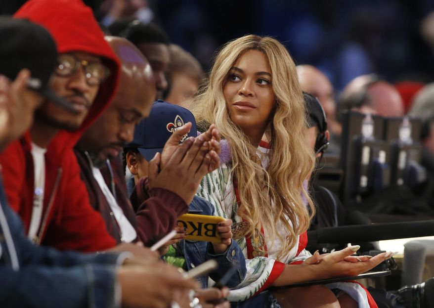 FILE - In this Feb. 19, 2017. file photo, Beyonce sits at court side during the second half of the NBA All-Star basketball game in New Orleans. A Houston high school student lost her battle with cancer on March 25, 2017, days after receiving a FaceTime call from the singer. (AP Photo/Max Becherer, File)