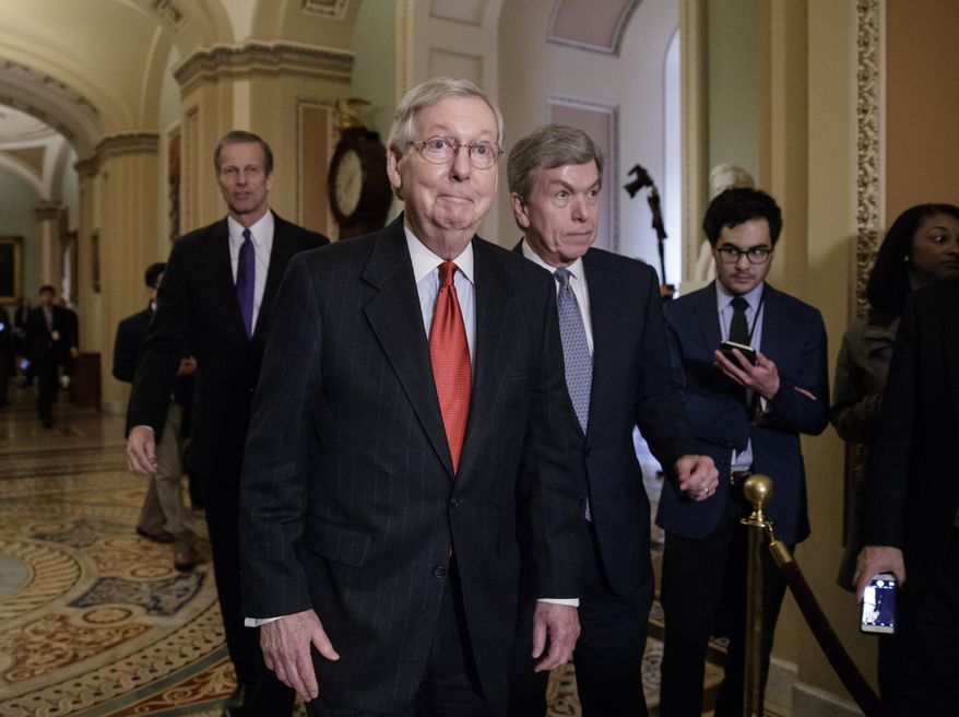 Senate Majority Leader Mitch McConnell of Ky., joined by Sen. John Thune, R-S.D., left rear, and Sen. Roy Blunt, R-Mo., right, arrives to speak with reporters following a closed-door strategy session, Tuesday, March 28, 2017, on Capitol Hill in Washington. (AP Photo/J. Scott Applewhite)
