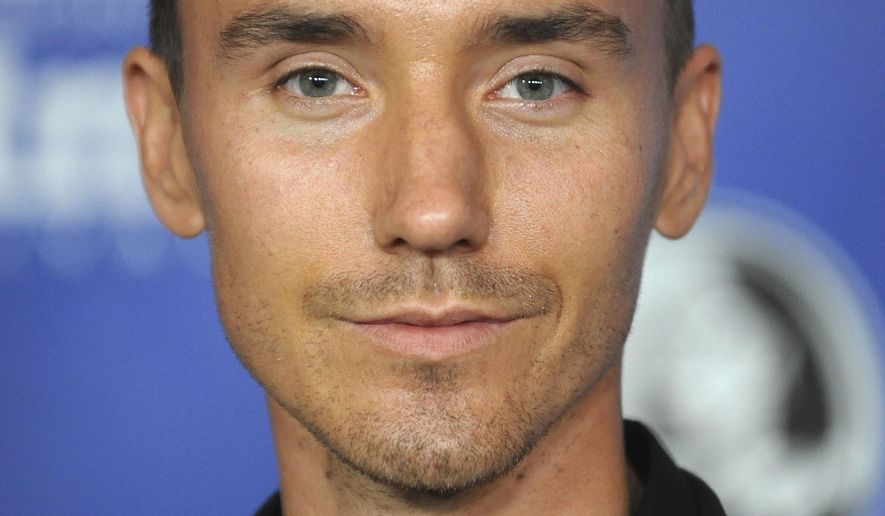 FILE - This Jan. 23, 2013 file photo shows Canadian filmmaker Rob Stewart at the Modern Master Award Ceremony at the Santa Barbara International Film Festival in Santa Barbara, Calif. The family of Stewart, who died during a shark filming excursion in the Florida Keys has filed a wrongful death lawsuit. The lawsuit blames negligence on the companies and individuals who organized the January dive that resulted in Stewart's death. (Photo by Richard Shotwell/Invision/AP, File)