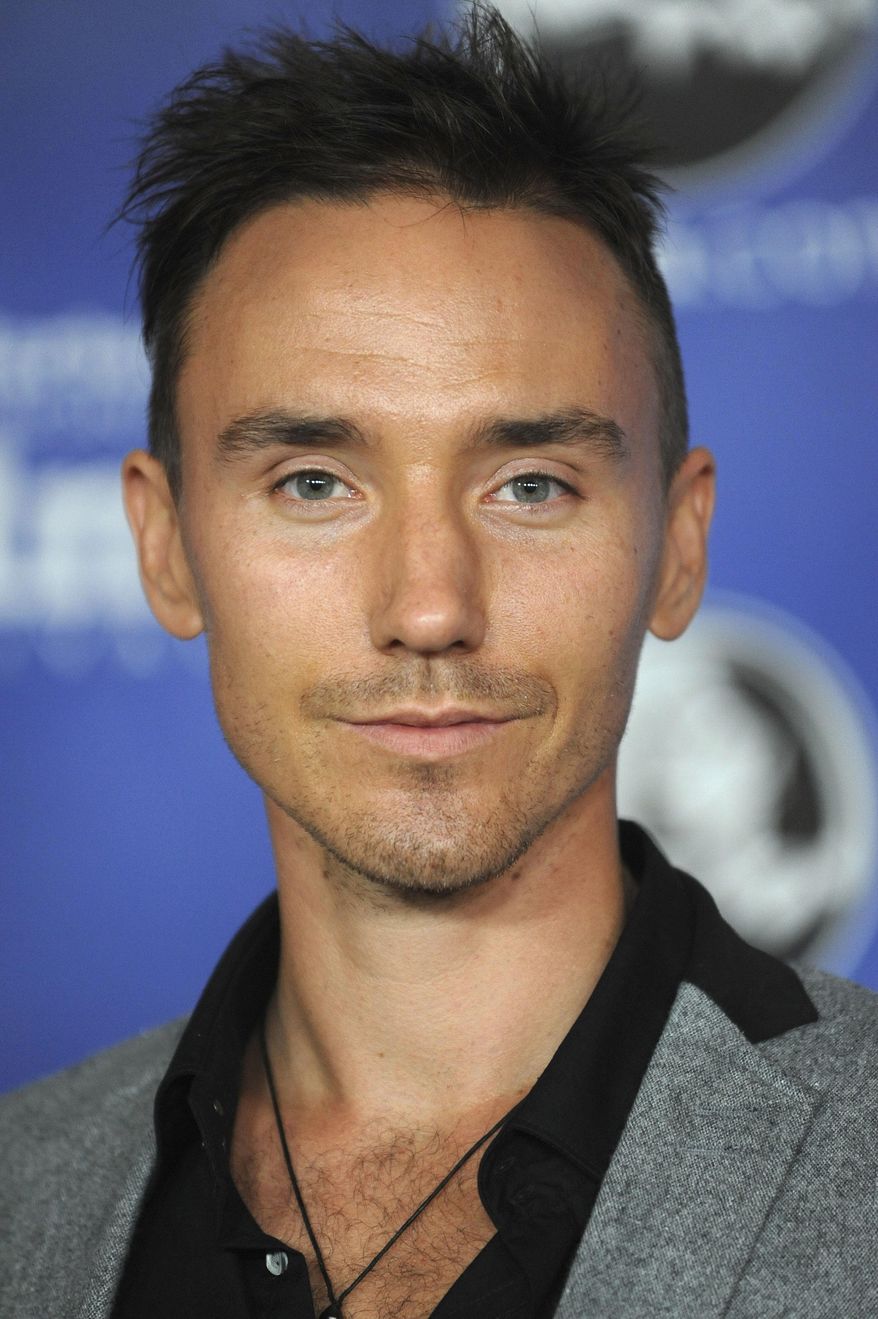 FILE - This Jan. 23, 2013 file photo shows Canadian filmmaker Rob Stewart at the Modern Master Award Ceremony at the Santa Barbara International Film Festival in Santa Barbara, Calif. The family of Stewart, who died during a shark filming excursion in the Florida Keys has filed a wrongful death lawsuit. The lawsuit blames negligence on the companies and individuals who organized the January dive that resulted in Stewart's death. (Photo by Richard Shotwell/Invision/AP, File)