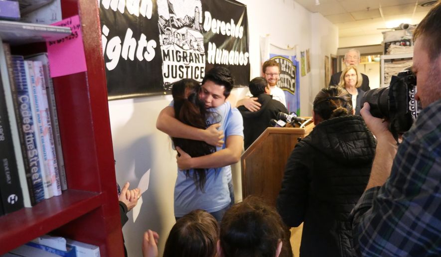 Immigrant justice activists Zully Palacios and Enrique Balaczar embrace at a news conference Tuesday, March 28, 2017, in Burlington Vt. Both were detained and then released later by Immigration and Customs Enforcement on alleged immigration violations. (AP Photo/Cory Dawson)