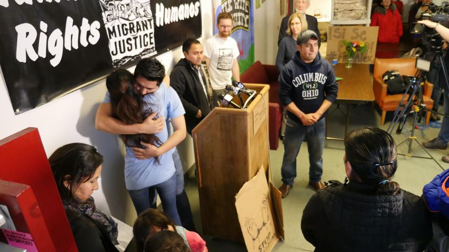 Immigrant justice activists Zully Palacios and Enrique Balaczar embrace at a news conference Tuesday, March 28, 2017, in Burlington Vt. Both were detained and then released later by Immigration and Customs Enforcement on alleged immigration violations. (AP Photo/Cory Dawson)