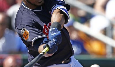 FILE - In this Saturday, March 11, 2017, file photo, Cleveland Indians' Edwin Encarnacion takes a swing during the first inning of a spring training baseball game against the Kansas City Royals in Goodyear, Ariz. Cleveland added slugger Edwin Encarnacion this winter to bolster a lineup with no holes. Encarnacion hit 42 homers and drove in 127 runs last year for Toronto. (AP Photo/Ross D. Franklin, File)